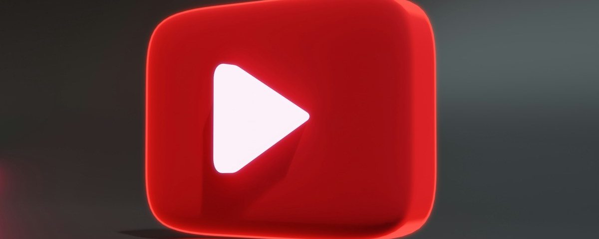 a red play button sitting on top of a table